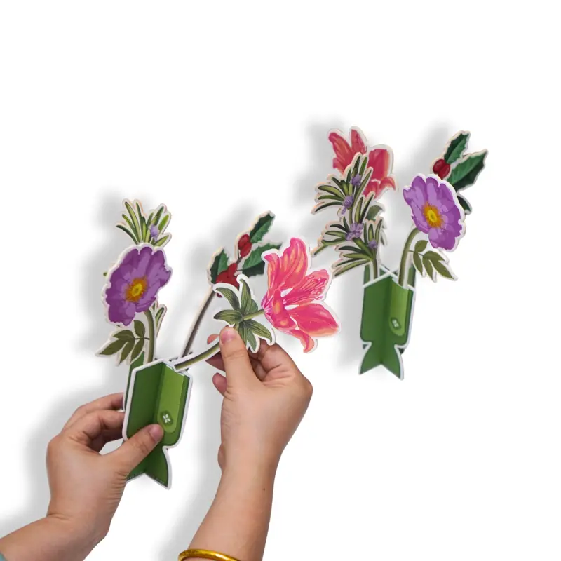Hands assembling 3D floral paper air freshener decoration