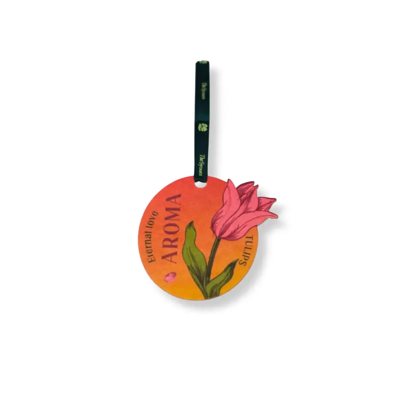 Closet paper air freshener hanging among sweaters, floral scent design